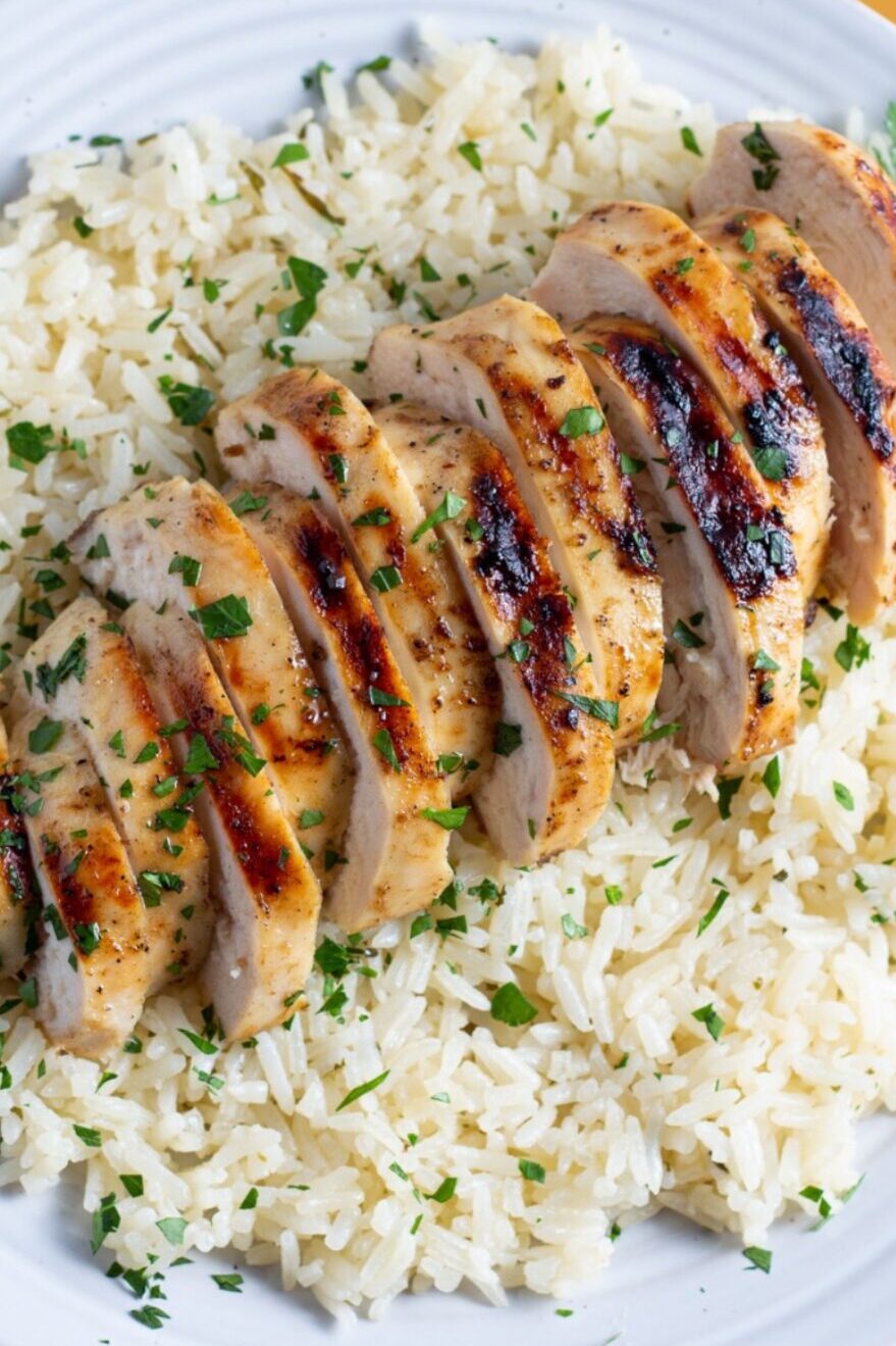 Chicken and rice served in a skillet with fresh herbs